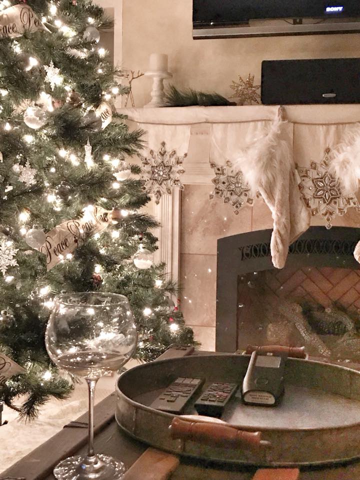 Decorated Christmas tree and fireplace mantel with stockings