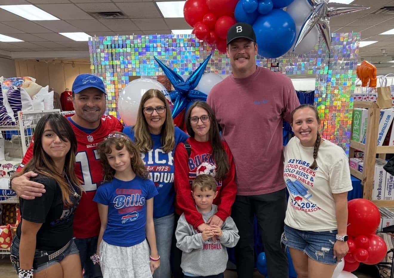 Extended family gathered inside a Totally Buffalo Store